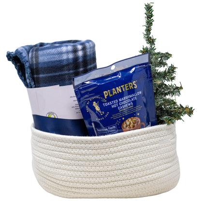 At Home Cozy Gift Basket with Plaid Blanket, candle, and planters cashews snacks