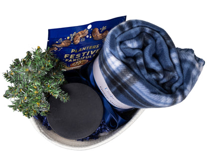 At Home Cozy Gift Basket with Plaid Blanket, candle, and planters cashews snacks